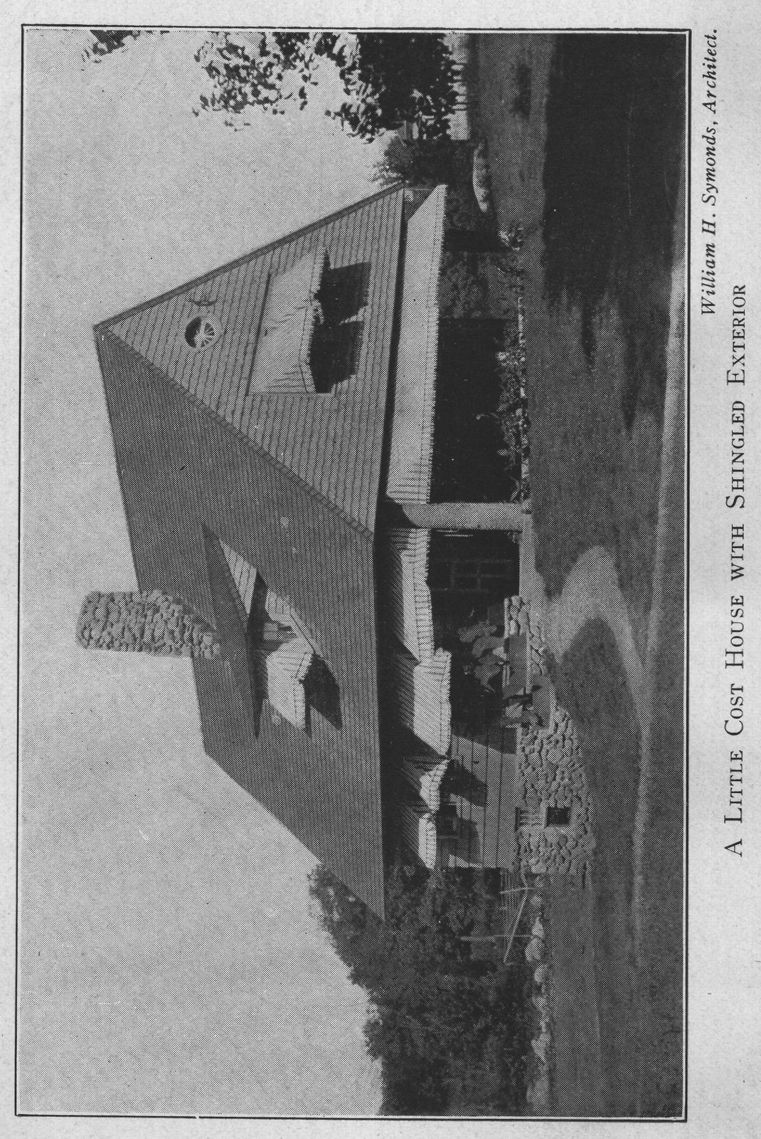 A LITTLE COST HOUSE WITH SHINGLED EXTERIOR